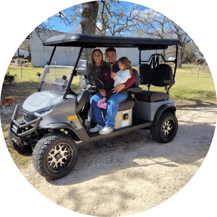 Family enjoying a golf cart ride