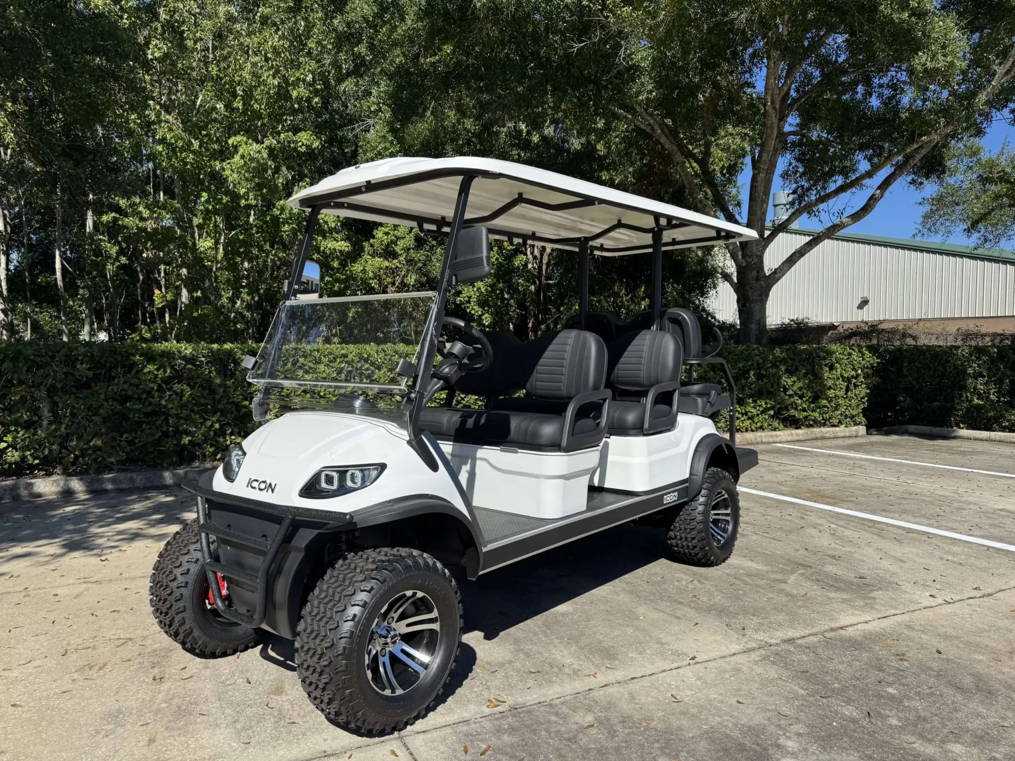 White luxury golf cart with lifted suspension