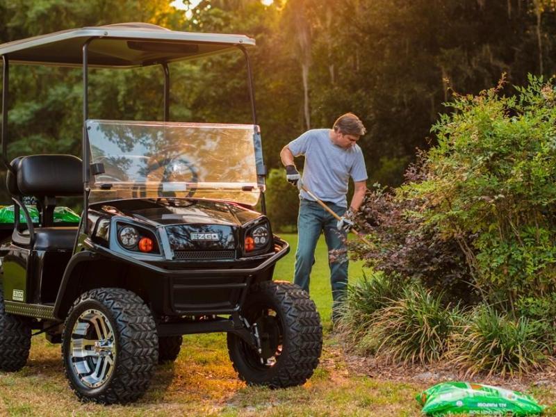 a man using a golf cart for faming