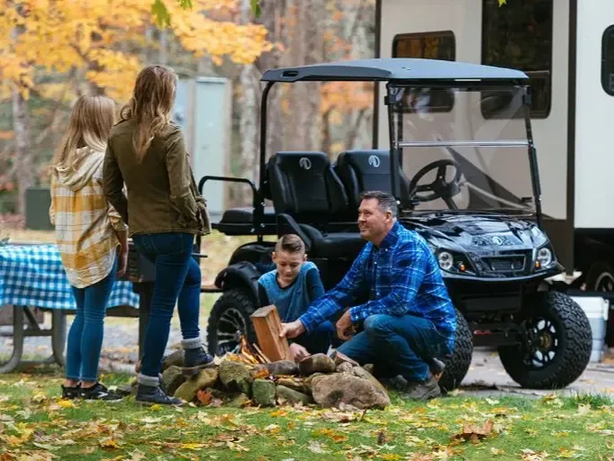 a family used a golf cart for camping